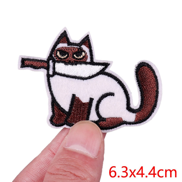 Brown White Cat 'Knife In Mouth | Staring' Embroidered Patch